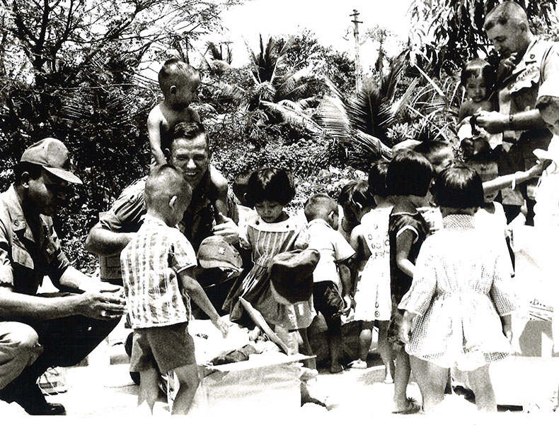 Frank with kids in Vietnam